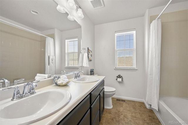 full bathroom with shower / bath combination with curtain, vanity, toilet, and tile patterned flooring