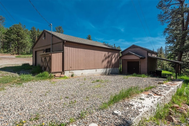 view of side of property with an outdoor structure