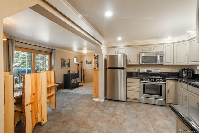 kitchen with crown molding and stainless steel appliances