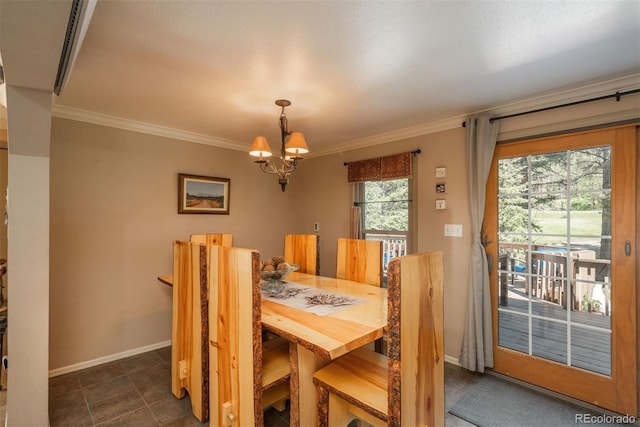 dining room featuring crown molding and a chandelier