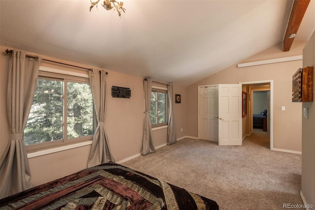 bedroom featuring light carpet, vaulted ceiling with beams, and multiple windows