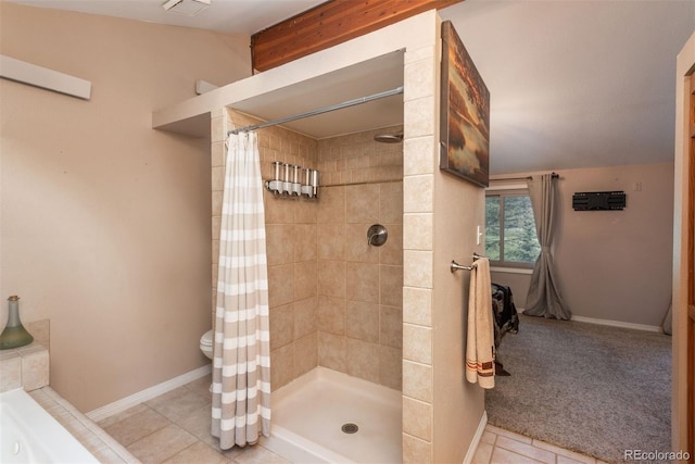 bathroom with toilet, tile patterned floors, and walk in shower