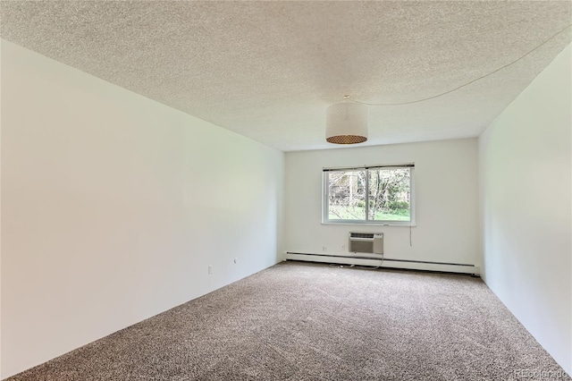 empty room with carpet flooring, a textured ceiling, a baseboard radiator, and a wall mounted AC