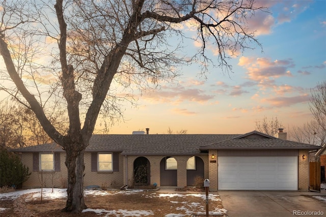 single story home featuring a garage