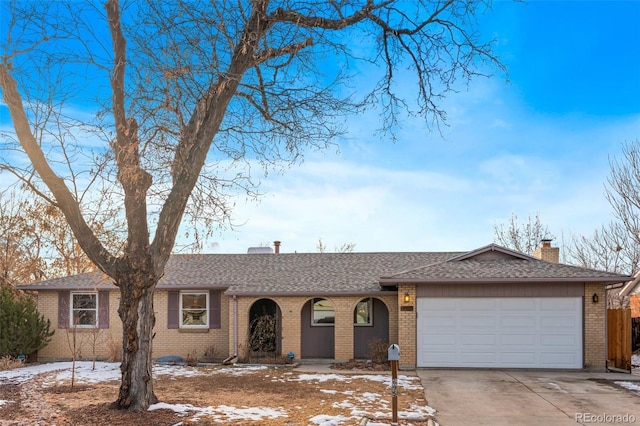 ranch-style house featuring a garage