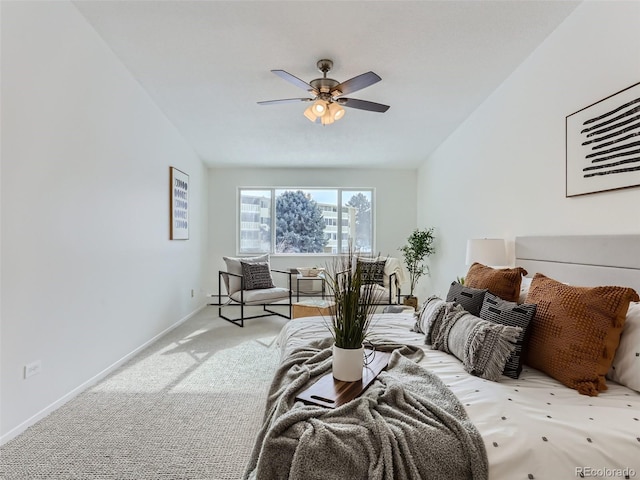 bedroom with ceiling fan and light carpet