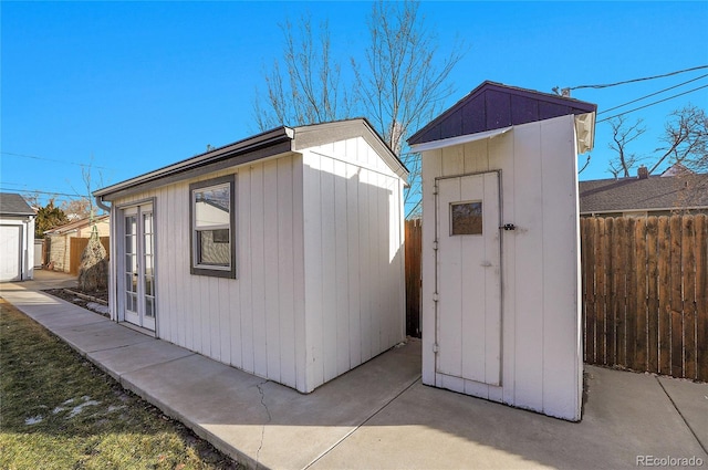 view of shed with fence