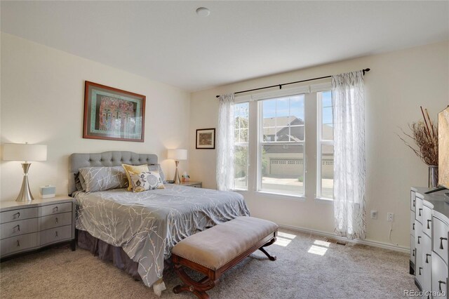 12348 W Gould Ave, Littleton, CO 80127 - bedroom featuring light carpet and baseboards