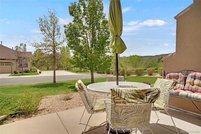12348 W Gould Ave, Littleton, CO 80127 - view of patio featuring outdoor dining area and a mountain view
