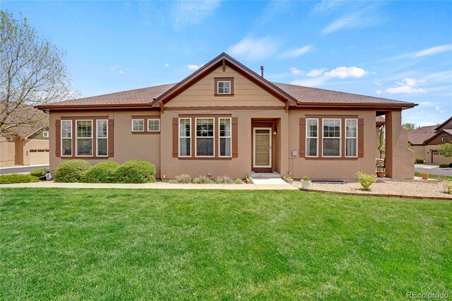 12348 W Gould Ave, Littleton, CO 80127 - view of front of property with a front yard and stucco siding