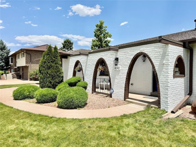 4192 S Vrain St, Denver, CO 80236 - view of property exterior featuring brick siding