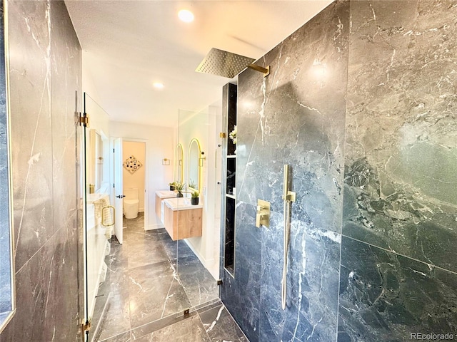 4192 S Vrain St, Denver, CO 80236 - bathroom with walk in shower, marble tiled flooring, vanity, and recessed lighting