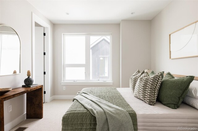 carpeted bedroom with baseboards