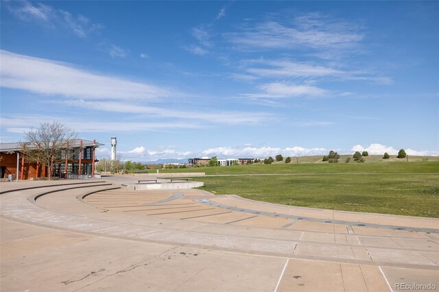 view of property's community with a lawn