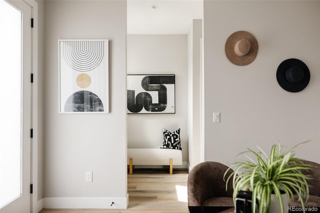 corridor featuring light wood-style flooring