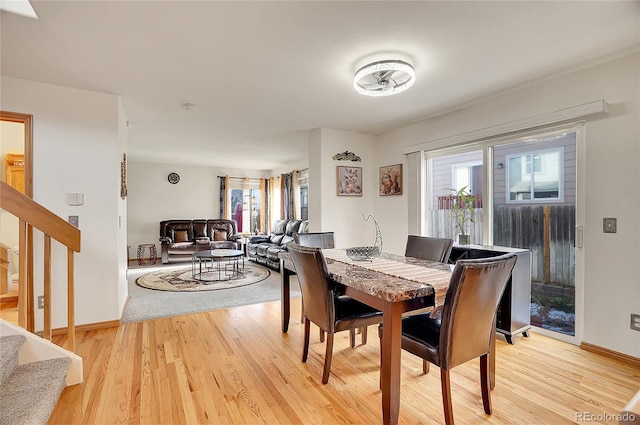 dining space with light hardwood / wood-style flooring