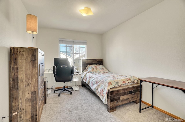 bedroom featuring light carpet