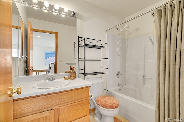 full bathroom featuring vanity, toilet, and shower / tub combo