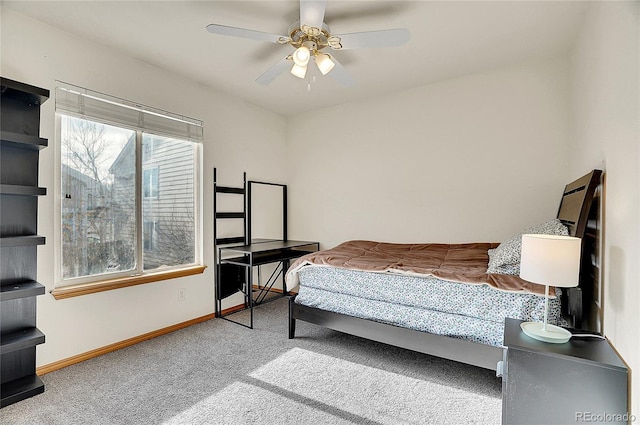 bedroom with light carpet and ceiling fan