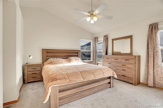 bedroom featuring ceiling fan, light colored carpet, and lofted ceiling