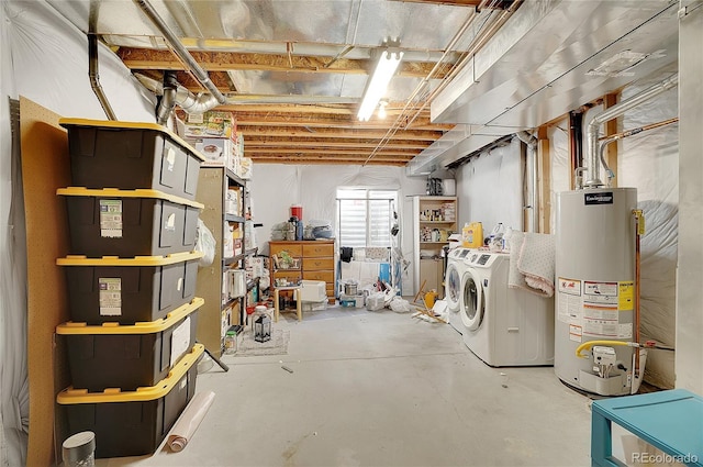 basement featuring separate washer and dryer and water heater