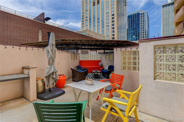 view of patio / terrace featuring fence