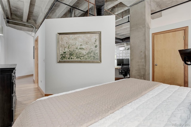 bedroom with wood finished floors