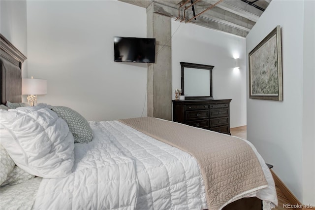 bedroom with wood finished floors