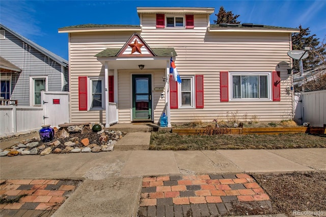 view of front of house with fence
