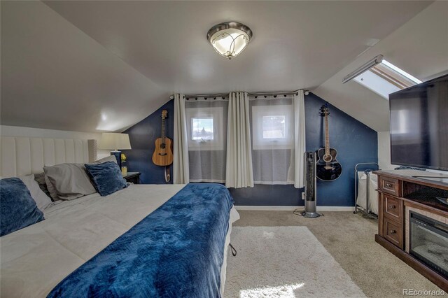 bedroom featuring baseboards, carpet, and lofted ceiling
