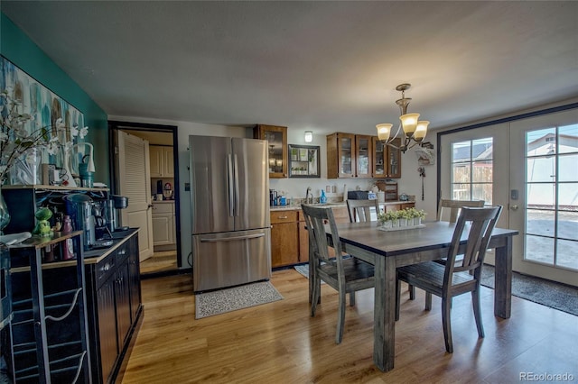 306 Elm St, Leadville, CO 80461 - dining room featuring a chandelier, light wood-style floors, and french doors