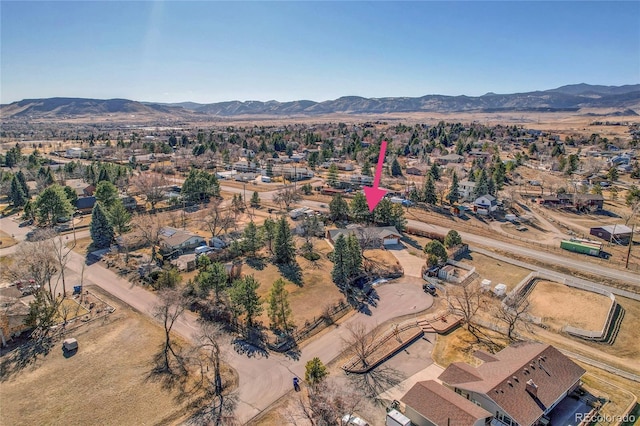 birds eye view of property featuring a mountain view