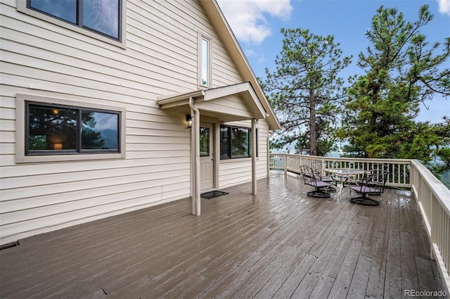 9189 Fallen Rock Rd, Conifer, CO 80433 - wooden deck with outdoor dining area