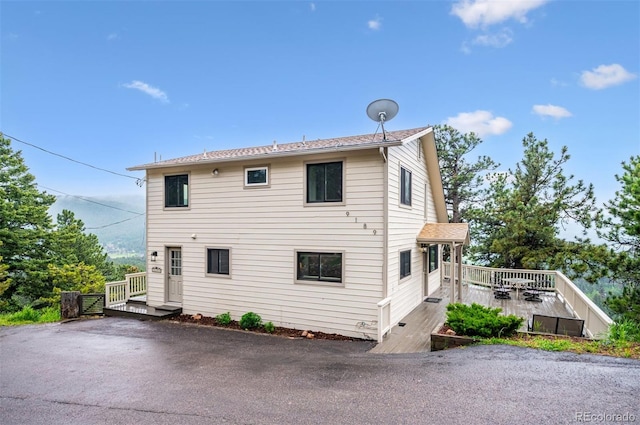 9189 Fallen Rock Rd, Conifer, CO 80433 - view of property exterior with a deck