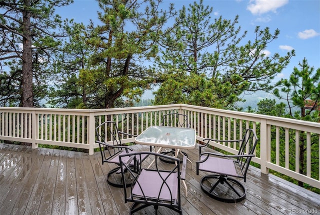 9189 Fallen Rock Rd, Conifer, CO 80433 - wooden terrace with outdoor dining space