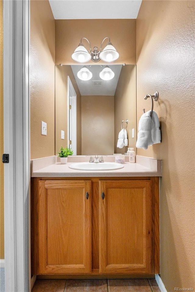 10262 Spotted Owl Ave, Highlands Ranch, CO 80129 - bathroom featuring vanity and tile patterned flooring