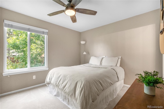 10262 Spotted Owl Ave, Highlands Ranch, CO 80129 - bedroom with light colored carpet and a ceiling fan