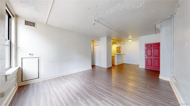 444 17th St Unit 301, Denver, CO 80202 - unfurnished room featuring wood finished floors and baseboards