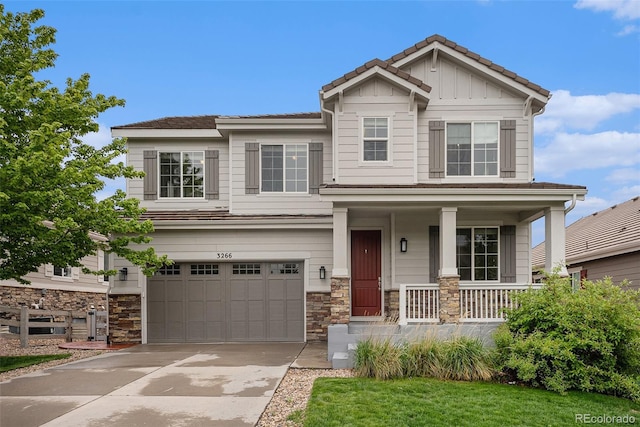 3266 Yale Dr, Broomfield, CO 80023 - craftsman house featuring a porch, an attached garage, stone siding, driveway, and board and batten siding