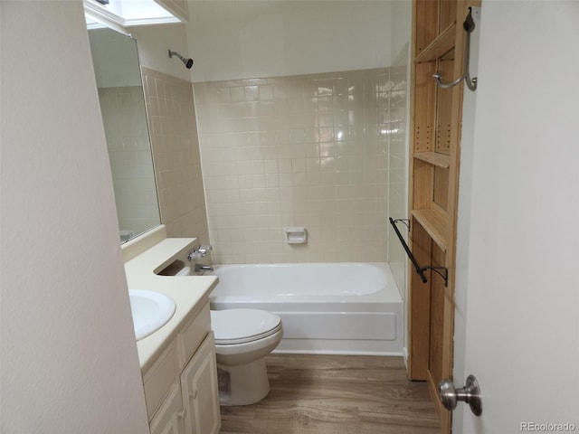 full bathroom with toilet,  shower combination, wood finished floors, and vanity