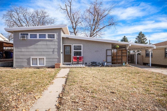 1654 S Perry St, Denver, CO 80219 - view of front of house featuring a front lawn and an attached carport