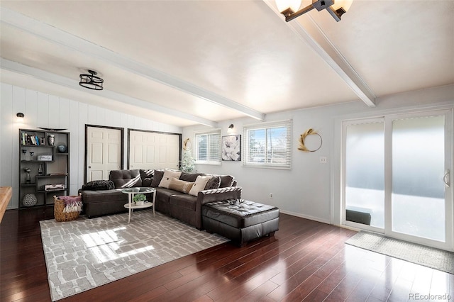 living room featuring vaulted ceiling with beams and dark wood-type flooring