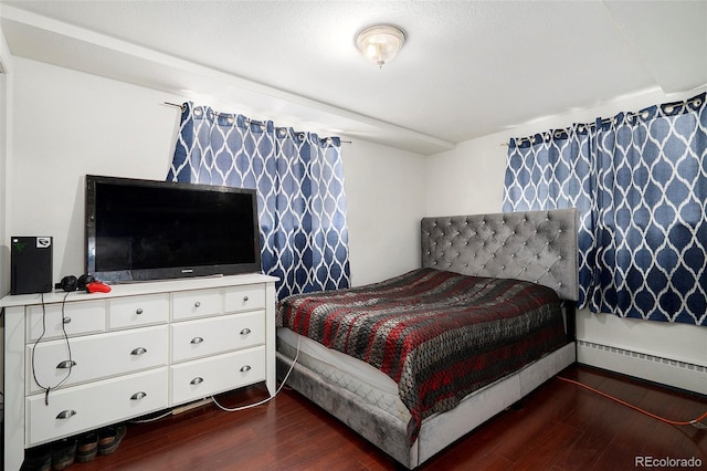 1654 S Perry St, Denver, CO 80219 - bedroom featuring dark wood-style flooring and a baseboard heating unit