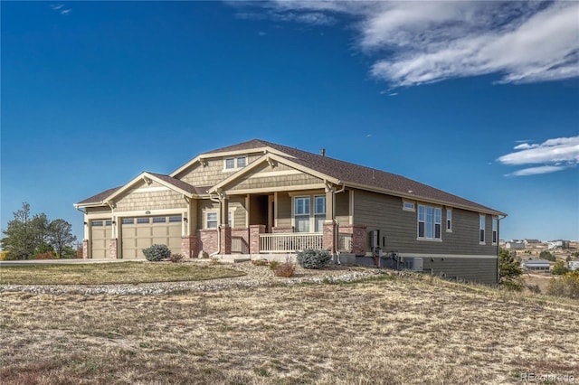 craftsman-style home featuring a garage and a porch