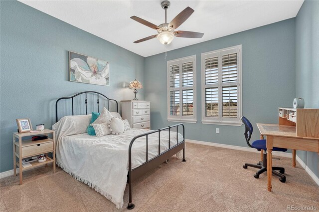 bedroom with carpet floors, baseboards, and a ceiling fan