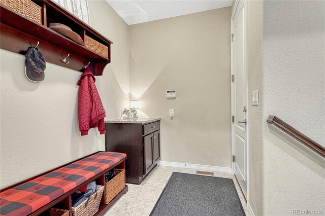 mudroom with visible vents and baseboards