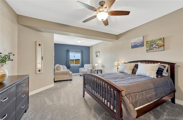 bedroom with light carpet, ceiling fan, and baseboards