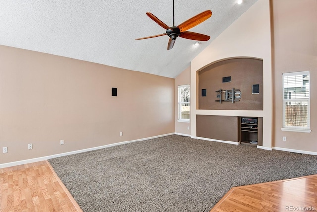 12535 Forest View St, Broomfield, CO 80020 - unfurnished living room featuring ceiling fan, plenty of natural light, wood finished floors, and high vaulted ceiling