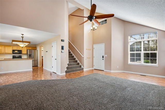 12535 Forest View St, Broomfield, CO 80020 - unfurnished living room featuring stairway, high vaulted ceiling, ceiling fan, and light colored carpet