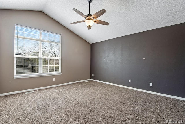 12535 Forest View St, Broomfield, CO 80020 - spare room featuring a ceiling fan, a textured ceiling, baseboards, lofted ceiling, and carpet